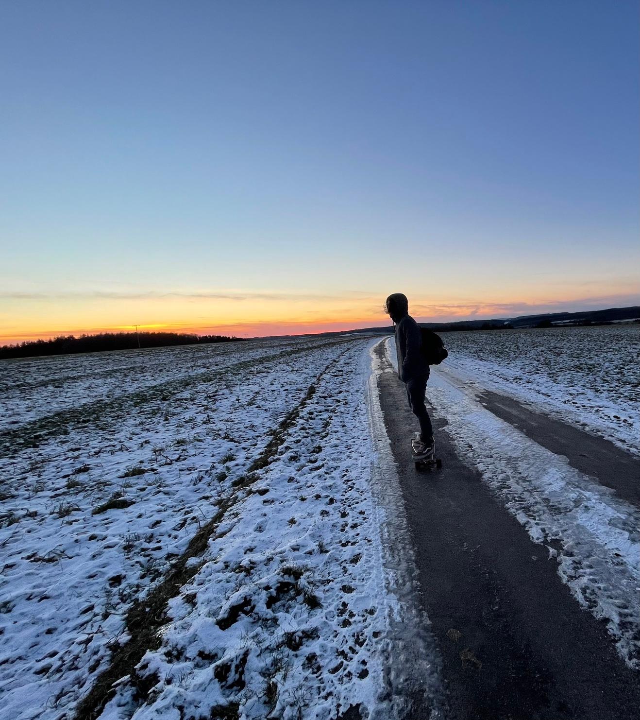 A picture of André longboarding in Luxembourg